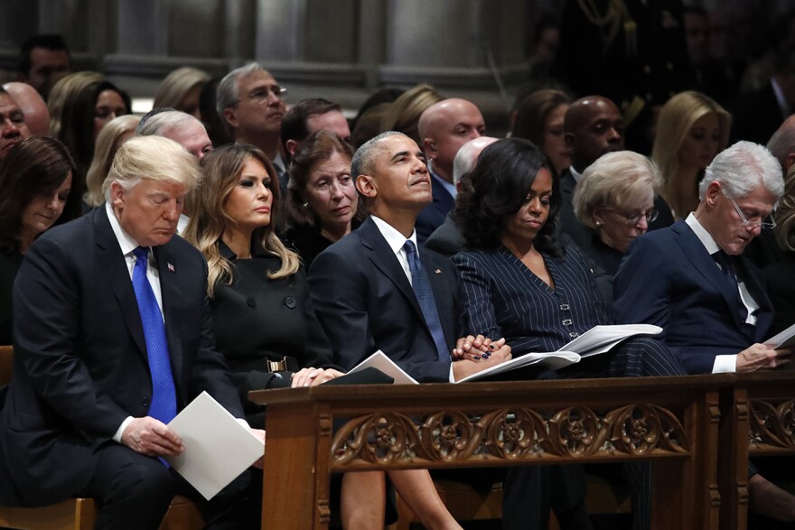 From left, President Donald Trump, first lady Melania Trump, former President Barack Obama, Michelle Obama, and former President Bill Clinton listen during a State Funeral at the National Cathedral, Wednesday, Dec. 5, 2018.