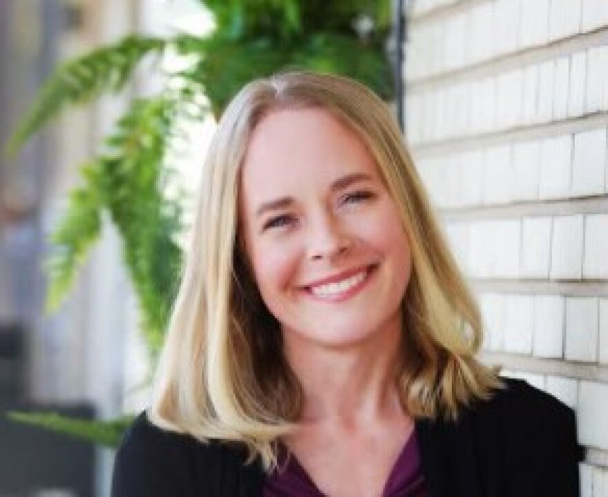 Kathy Snyder, the director of Midland Area Wellbeing Coalition, smiles for a portrait.