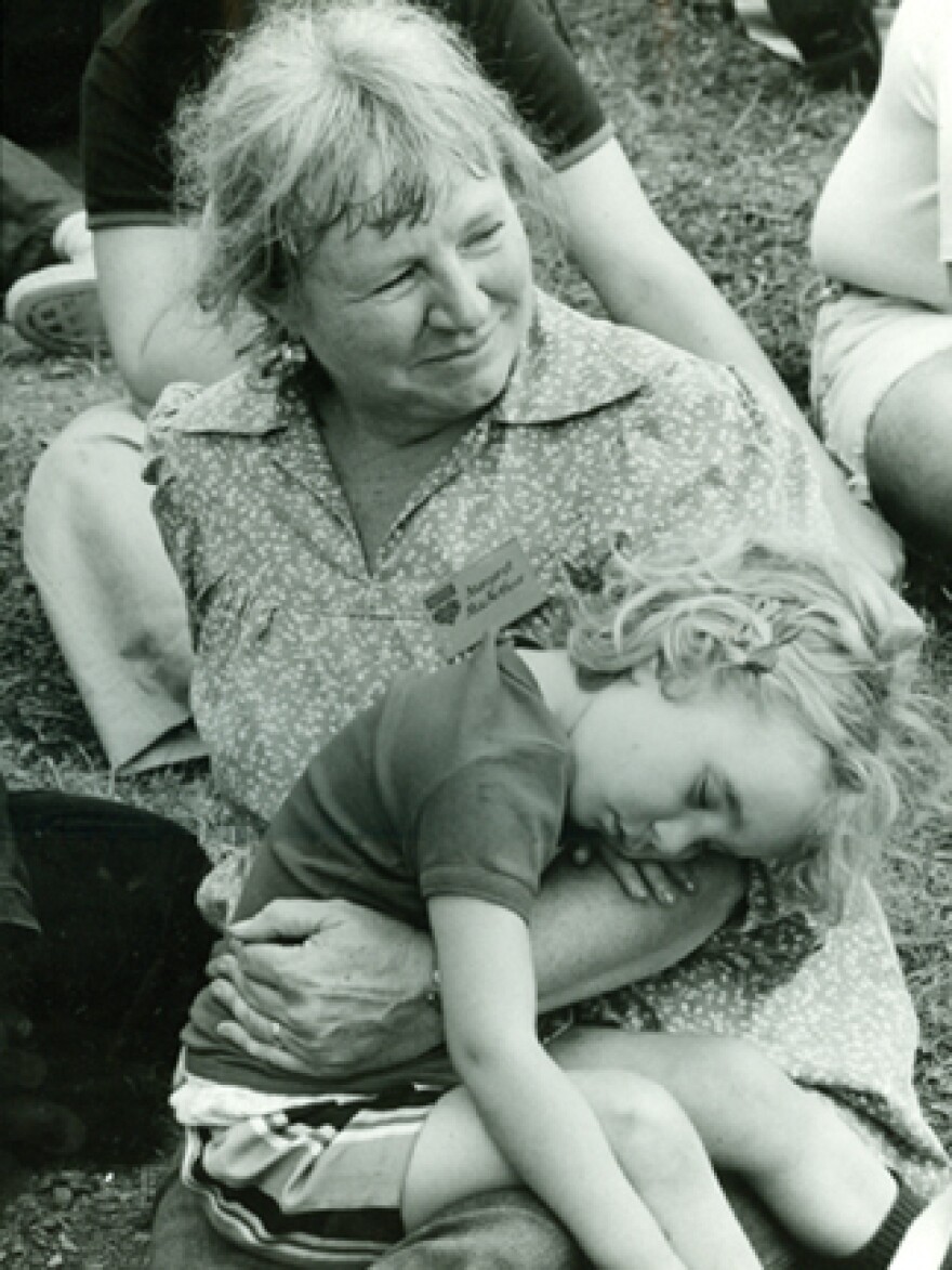 Margaret MacArthur cradles a young Robin.