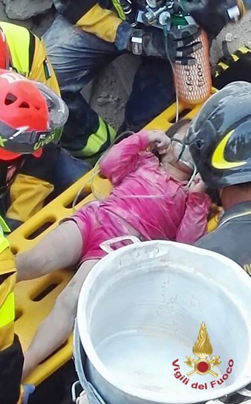 Italian firefighters pull out Giorgia Rinaldo from under the rubble of the town of Pescara del Tronto, central Italy, on Wednesday.