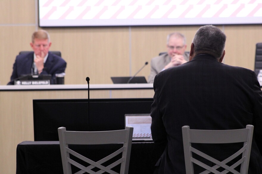 Gil Alvarez (foreground), deputy superintendent for Wichita Public Schools, presents a recommended bond proposal to the Wichita Board of Education. In the background are Superintendent Kelly Bielefeld and Board President Stan Reeser.