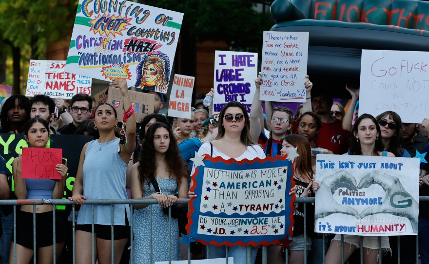 EDS NOTE: OBSCENITY - People protest outside the arena where Vice President JD Vance spoke at a Turning Point USA tour stop at the University of Georgia in Athens, Ga., Tuesday, April 14, 2026. (AP Photo/Erik S. Lesser)