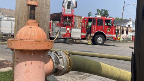    Firefighters put out "hot spots" remaining after a fire destroyed south side Columbus grocery store Jequeta's #2.