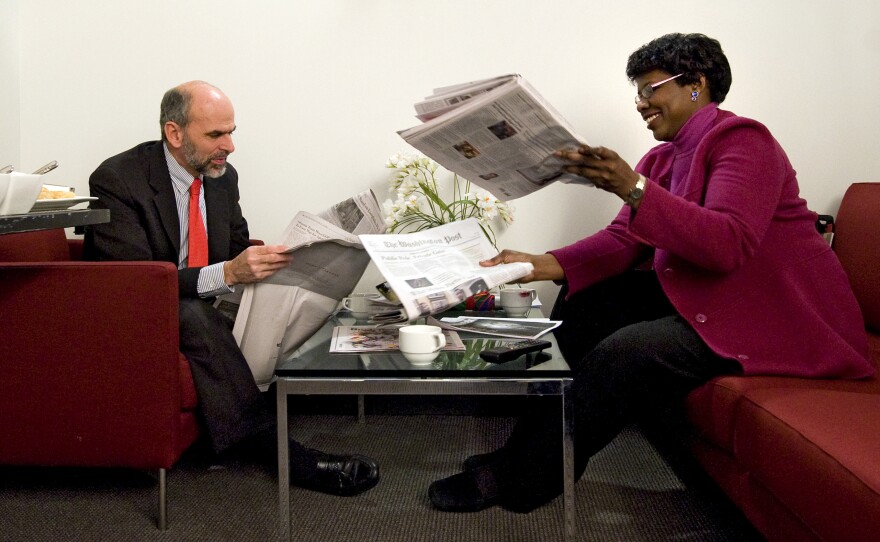 Gerald Seib (left) and Gwen Ifill go over the news before filming ABC's <em>This Week</em> at the Newseum in Washington, D.C., in December 2008.