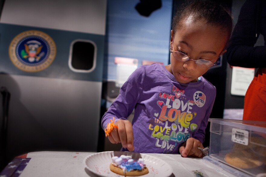 Olyvia Berry, 7, decorates a sugar cookie at Madame Tussauds Wax Museum. Encouraging kids to vote through age appropriate activities is a fun way to share Election Day.