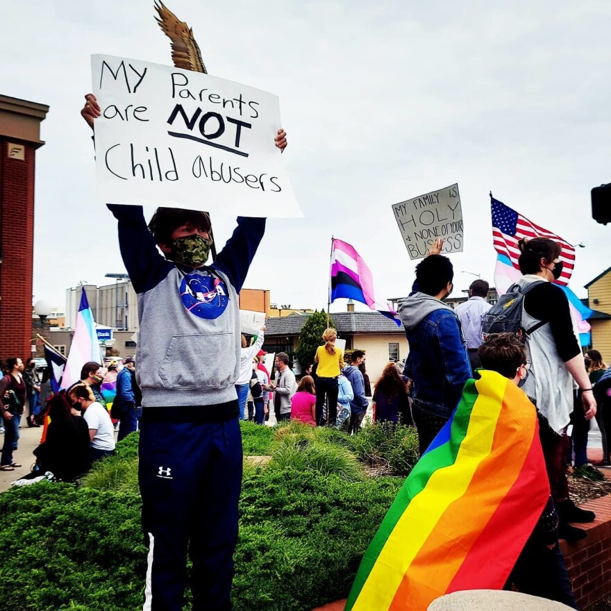 Eight grader Grayson Briggle protests for his rights as a transgender person in Texas.