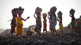 Local villagers scavenging  coal illegally from an open-cast mine in a village near Jharia, India, in 2012.