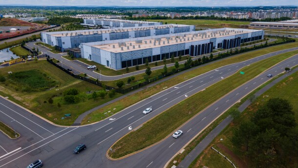 Cars drive past data centers in Virginia