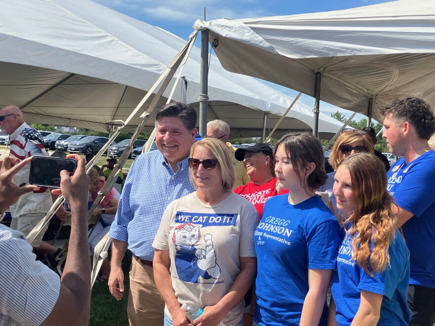 Illinois Gov. JB Pritzker poses for photos with supporters at the Salute to Labor picnic in East Moline, Sept. 7, 2026.