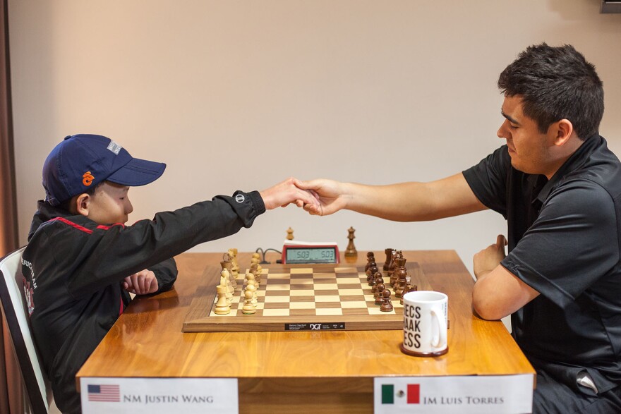 Justin Wang (left), playing against Luis Torres. Wang, 12, was the youngest player in the event and achieved his first international master norm. 2017