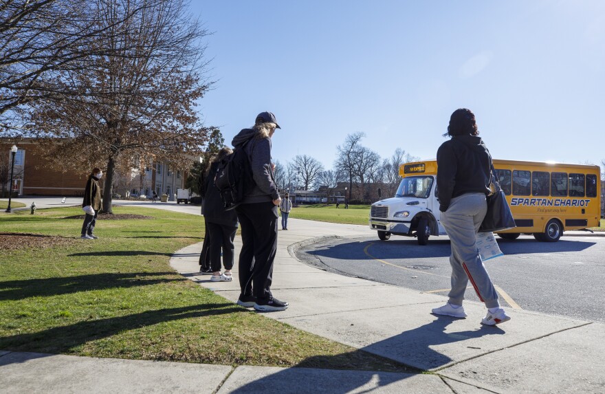 Students wait for the Spartan Chariot bus service at UNCG