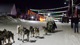 First-place finisher Pete Kaiser arrives at the finish line in Nome at the end of the 2012 Norton Sound 450. (Photo: David Dodman, KNOM)