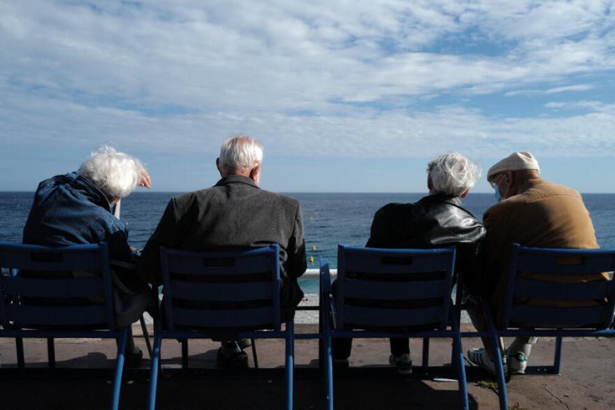 Elderly look at the Mediterranean sea on June 2, 2021. (Valery Hache/AFP via Getty Images)