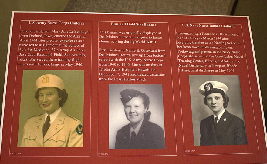 A display shows pictures and stories of three Iowa military nurses.