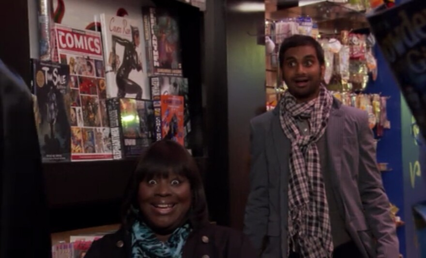 This screenshot of Donna and Tom, when Ben bought himself a Batman costume on "Treat Yo Self" day, could be your treat to yo self as well.