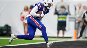 Buffalo Bills wide receiver Joshua Palmer runs the ball into the end zone for a touchdown during the second half of an NFL football game against the Houston Texans, Sunday, Sept. 13, 2026, in Houston.