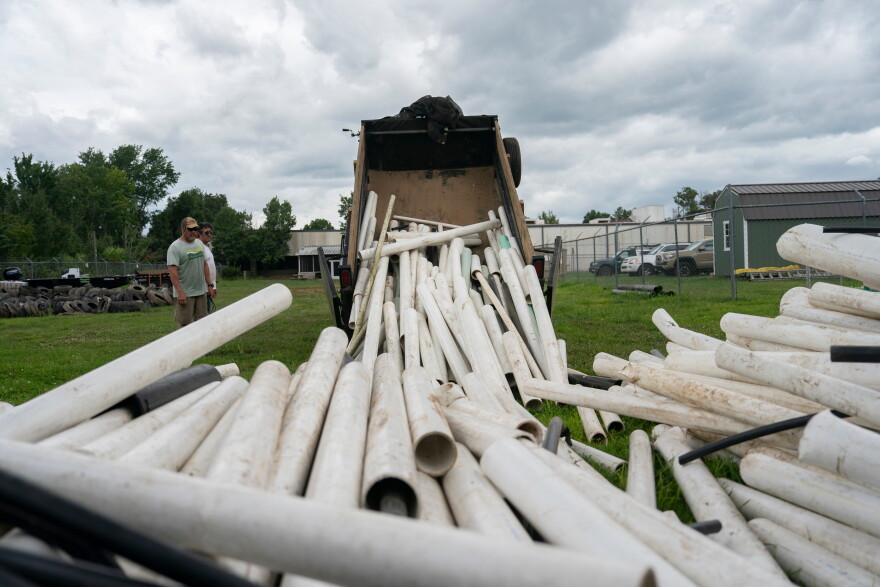 IPEX PVC pipe cleared from the riverbank is dumped at MountainTrue headquarters Wednesday, July 22, 2026, in Alexander, N.C.