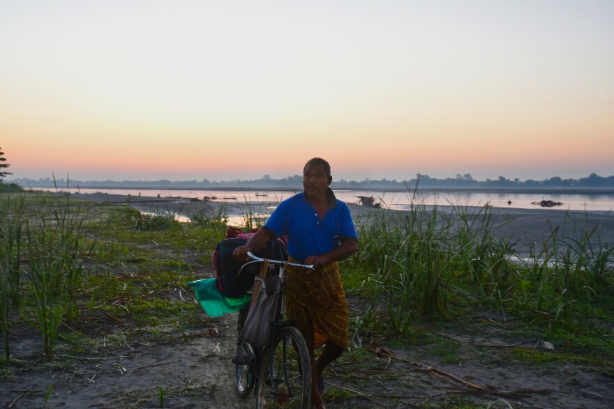 Jadav Payeng covers the distance from the island banks to his forest on his bicycle, carrying the supplies he uses while working on his forest and abundant vegetable farm.