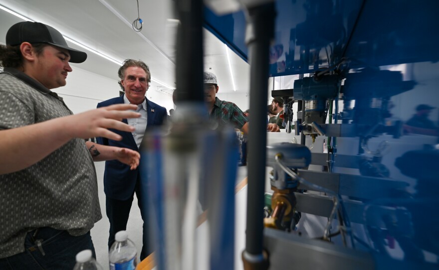 Lackawanna College senior William Parry shows U.S. Secretary of the Interior Doug Burgum what he is learning at the college.