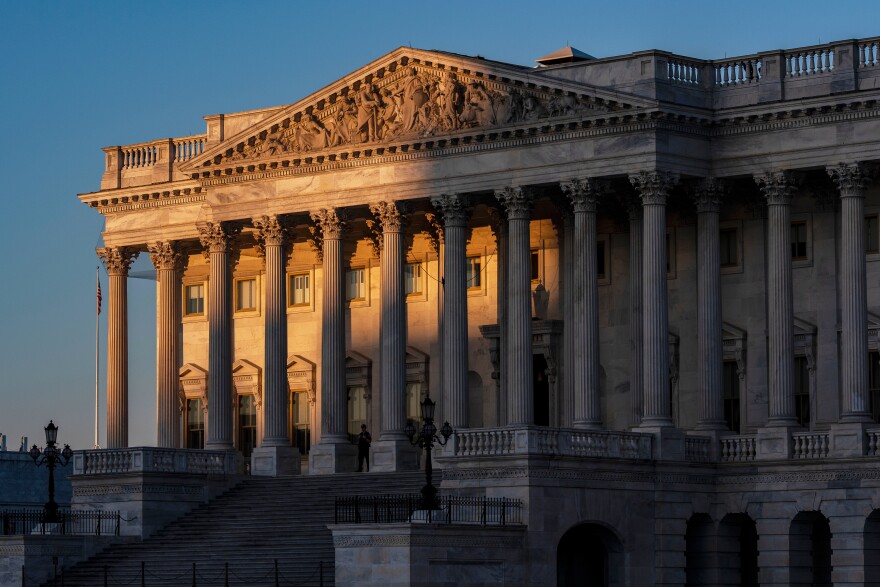 FILE - The House of Representatives at the Capitol is illuminated at dawn in Washington, Oct. 6, 2025. (AP Photo/J. Scott Applewhite, File)