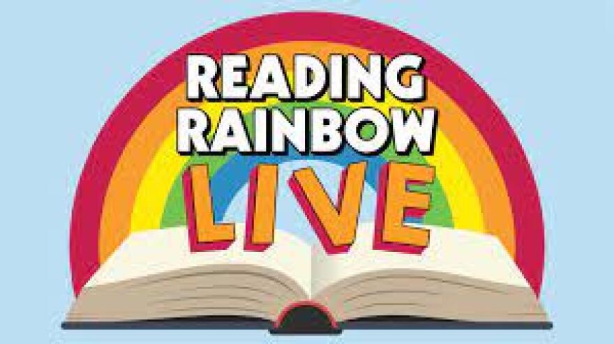 Billboard for Reading Rainbow Live shows multiple colors spread above an open book. 