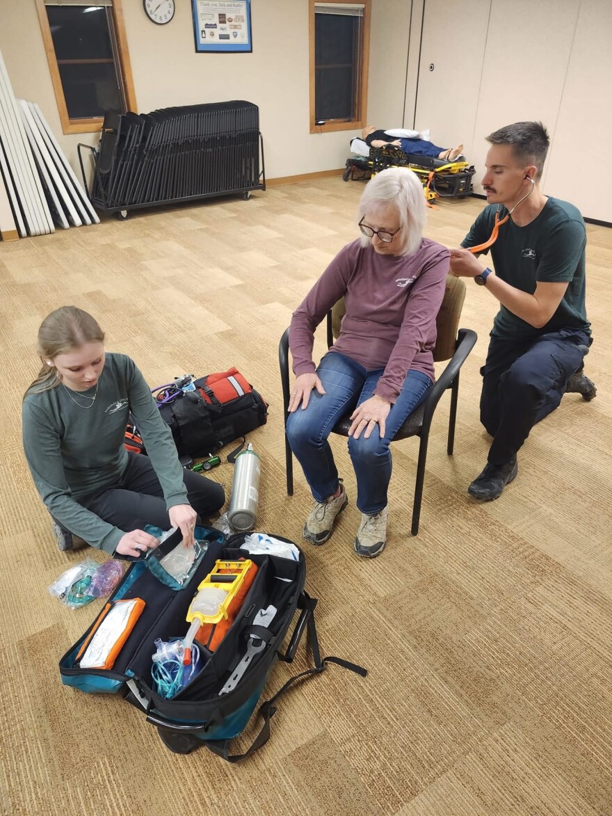 Lake City EMT students Rowan McNeese, left, Lori Stewart, center, and Doug Eby, right, in the classroom.