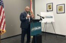 Man speaking at a podium
