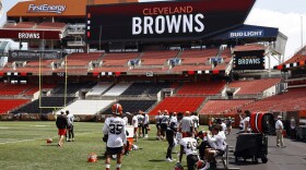 The Cleveland Browns defense takes a break during an NFL football practice at FirstEnergy Stadium, Thursday, June 16, 2022, in Cleveland. 