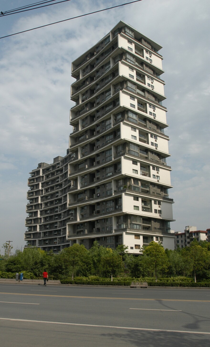 In Wang's Vertical Courtyard Apartments, residents plant small trees that are special to them, to differentiate their tower from others.