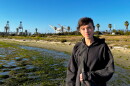 Maria BC standing in front of the port cranes at Middle Harbor Park. 