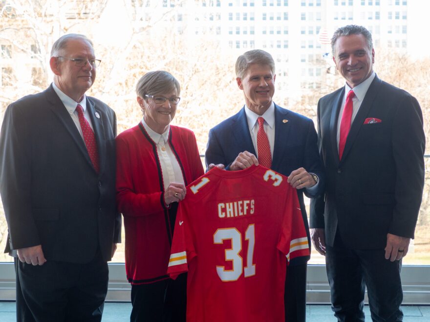 The Kansas Legislature is beginning work on a bill creating a state sports authority to own the Wyandotte County stadium built for use by the Kansas City Chiefs. Private ownership is necessary to prevent bonds issued for the project to be subject to federal income tax. In this image from December, from left, are House Speaker Dan Hawkins, Gov. Laura Kelly, Chiefs owner Clark Hunt and Senate President Ty Masterson.