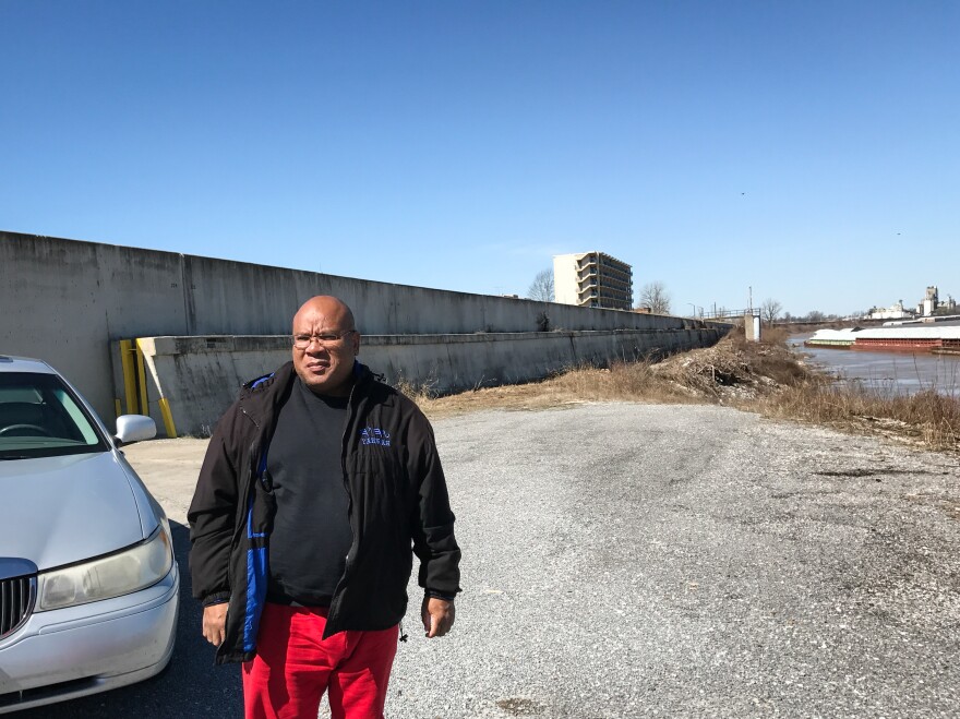 Pastor and community activist Phillip Matthews stands by a levee that protects the town from the Ohio River. Matthews says he's watched for 40 years as Cairo declined, battling outside economic forces, corruption and racial tension.