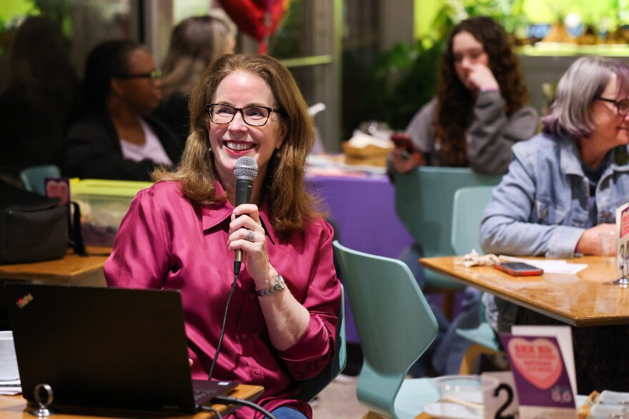 Sherri Cook with Wholly Informed Sex Ed reads out a question for Sex Ed Trivia Night on Thursday, Feb. 8, 2024, at Hello Dumpling in Dallas.