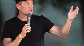 Cyclist Lance Armstrong addresses participants at a Livestrong event in October.
