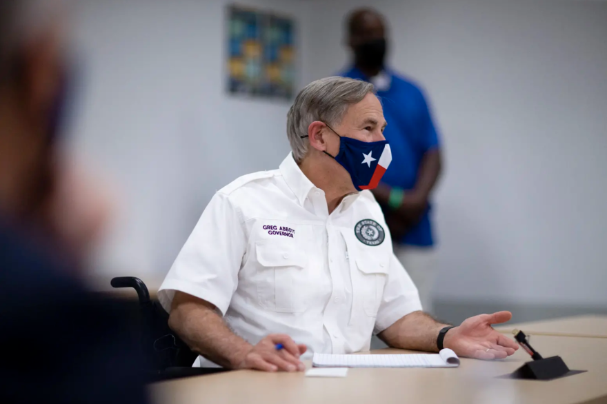Texas Gov. Greg Abbott meets with local leaders in El Paso last month to discuss the coronavirus situation. At an event Thursday, he proposed enhancing certain penalties for crimes related to protests. 