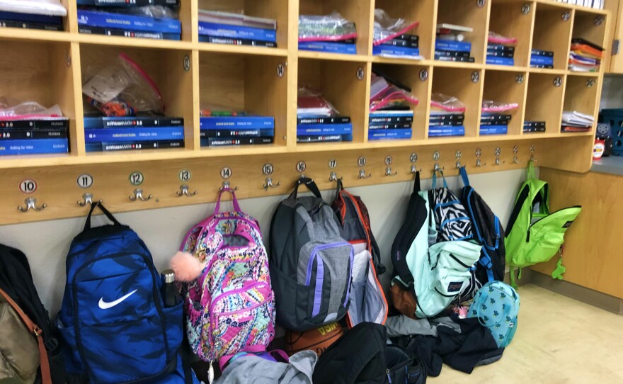 Student backpacks hanging on hooks in a classroom at Northside ISD's Mireles Elementary in January 2019.