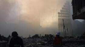 Smoke rises from the rubble at ground zero on Sept. 12, 2001 after the September 11 terrorist attacks in New York City.(AP Photo/Shawn Baldwin)