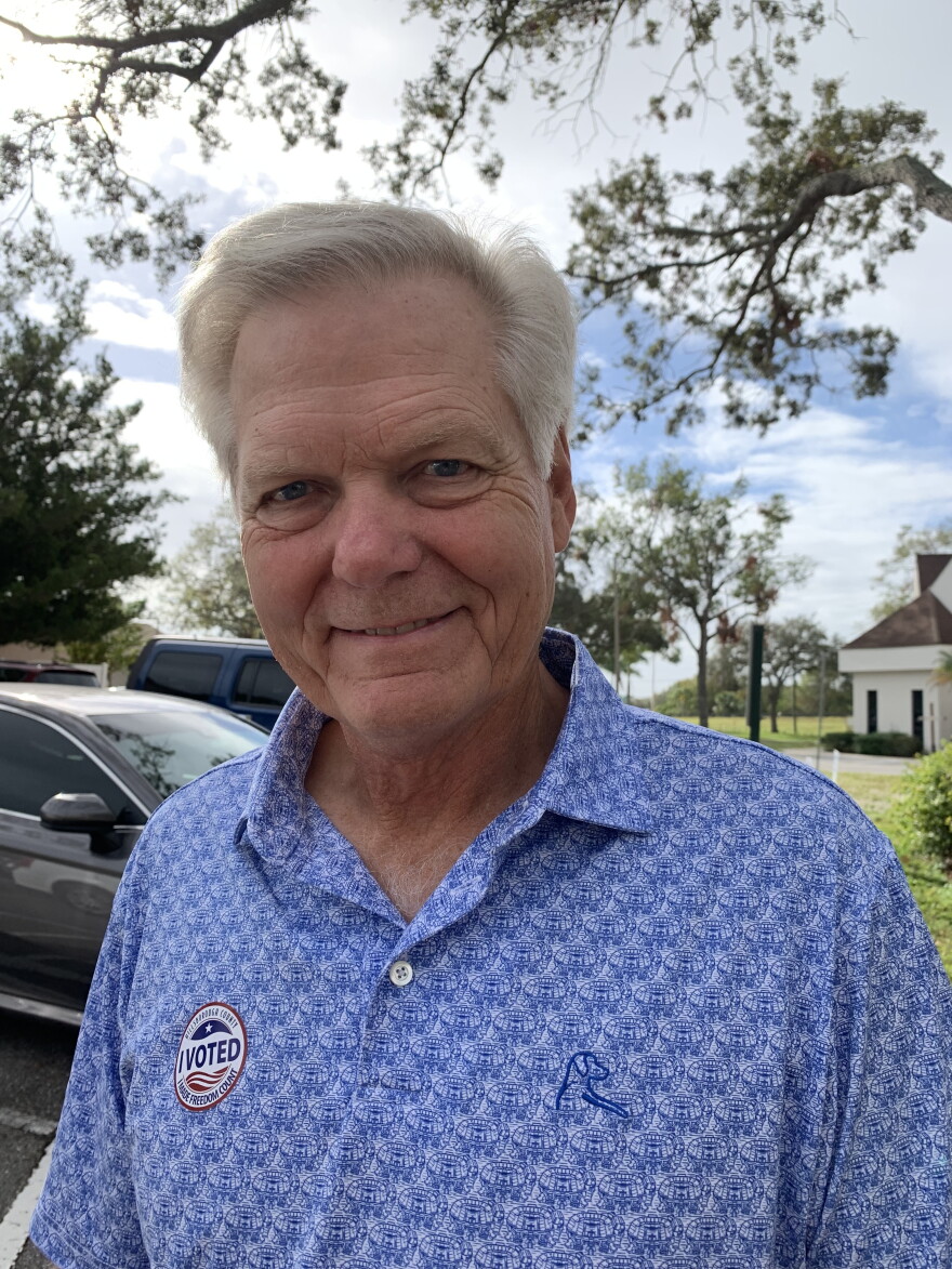 Man wearing a blue shirt and I Voted sticker