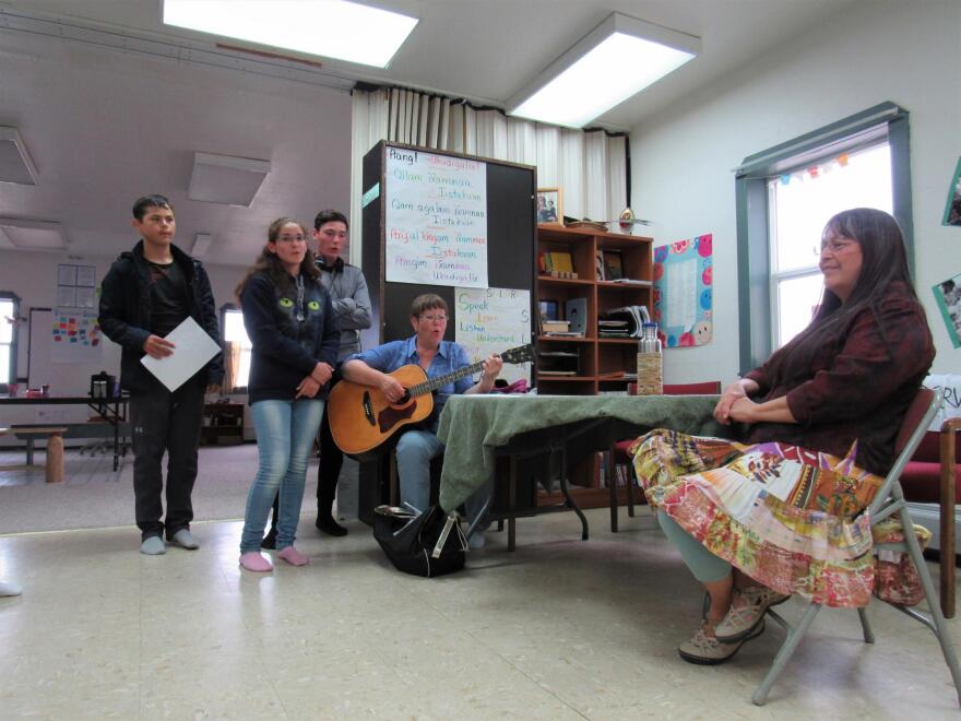 Artyem Popov, Avdeyenko, Petrov, and Natalya Sergeevna Fomina perform Aleutsky music for Aquilina Lestenkof of St. Paul. (Laura Kraegel/KUCB)