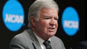 NCAA President Mark Emmert speaks at a news conference at the Target Center, site of of the Women's Final Four NCAA college basketball tournament, March 30, 2022, in Minneapolis. Emmert is stepping down after 12 years on the job. NCAA Board of Governors Chairman John DeGioia announced the move Tuesday, April 26, and said it was by mutual agreement. Emmert will continue to serve in his role until a new president is selected and in place or until June 30, 2023.