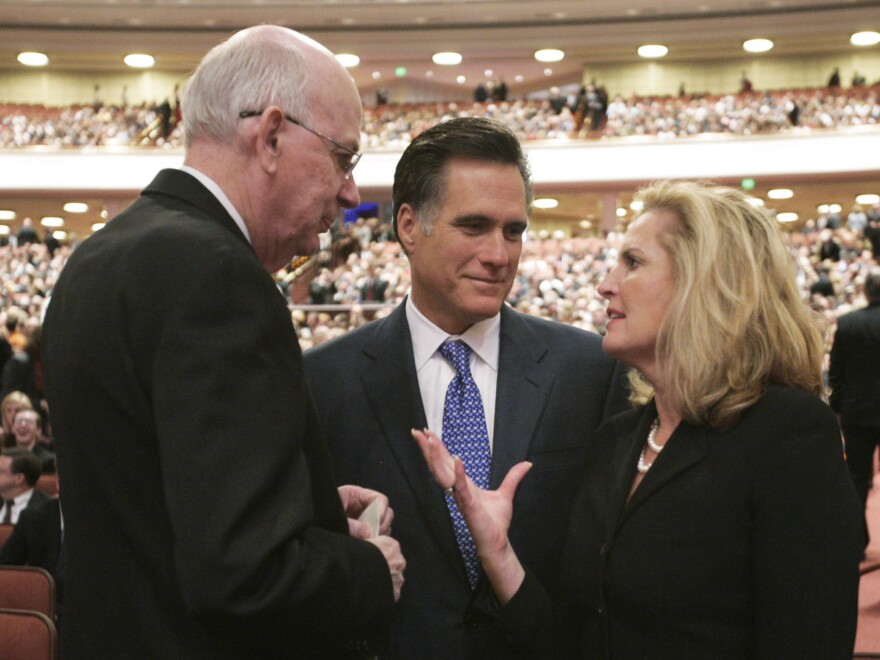 Mitt Romney, his wife, Ann, and then-Sen. Robert Bennett, R-Utah, attend the 2008 funeral of Gordon B. Hinckley, president of the Church of Jesus Christ of Latter-day Saints, in Salt Lake City.