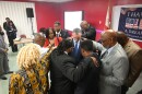 Tallahassee faith leaders laying hands in prayer over Florida Democratic Gubernatorial Candidate David Jolly at the Bethel Family Life Center on Feb. 10th, 2026.