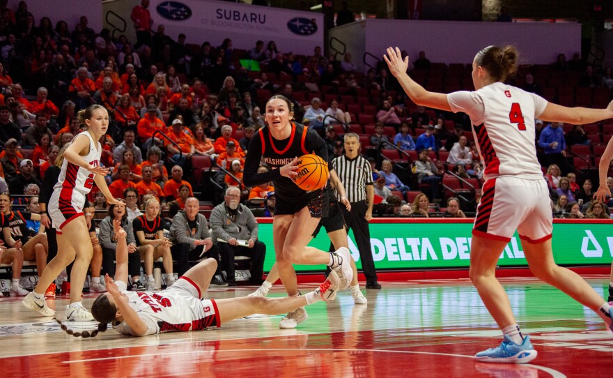 Girls high school basketball players inside an arena