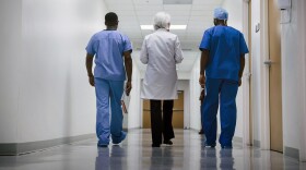 Doctor and nurses in hospital.