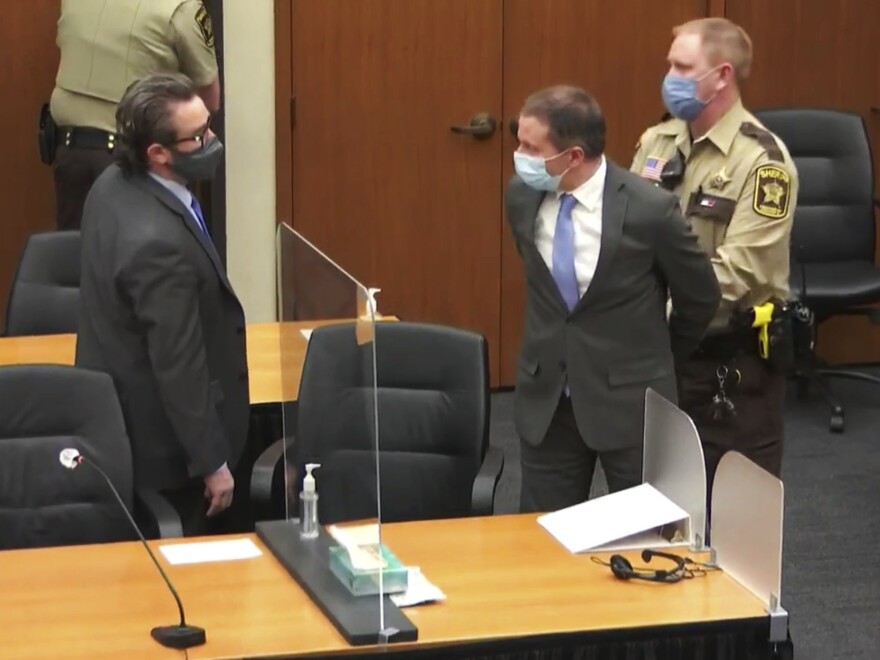 Former Minneapolis police Officer Derek Chauvin (center) is taken into custody as his attorney, Eric Nelson looks on, after the verdicts were read at Chauvin's trial for the 2020 death of George Floyd on Tuesday at the Hennepin County Courthouse in Minneapolis, Minn.