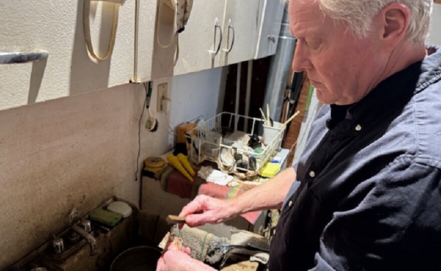 Patrick Donley cleans each piece he digs up