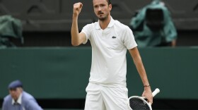 Daniil Medvedev of Russia reacts after winning a point against Jannik Sinner of Italy during their quarterfinal match at the Wimbledon tennis championships in London, Tuesday, July 9, 2024. (AP Photo/Alberto Pezzali)