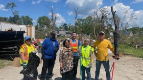 Volunteers helping family members clean up demolished family home on Saturday, May 18. Family built home in 1982.