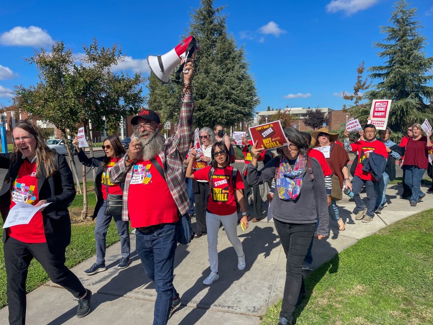 Fresno faculty walked across campus and onto Shaw Avenue as they chanted for a new contract.