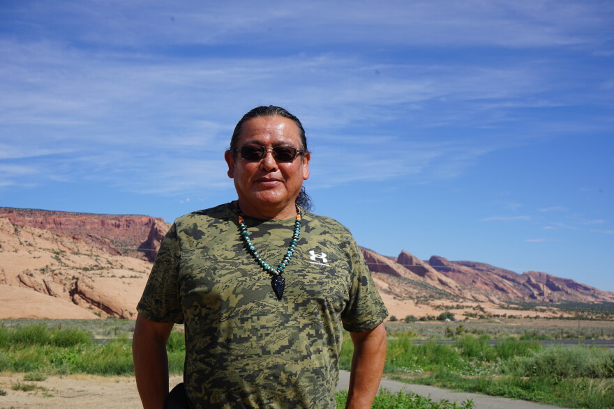 Raymond Peaches stands near where one proposed hydropower project might one day sit on the Navajo Nation. Critics of the project point to questionable tactics used by the developer and his allies as they advocate for the facility.